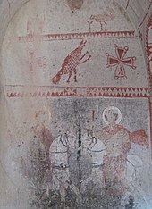 Saints George and Theodore on horseback killing the dragon, fresco in Saint Barbara church in Goreme, Cappadocia. Dated to the early 11th century, this image has been identified as the oldest known depiction of Saint George as dragon-slayer. George kappad.jpg