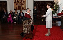 Taylor's investiture as a Knight Companion of the New Zealand Order of Merit by the governor-general, Dame Patsy Reddy, at Government House, Wellington, on 4 May 2021 Ian Taylor investiture as KNZM.jpg