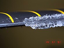 Ice accumulation on a rotor blade in a wind tunnel Icing on a rotor.jpg