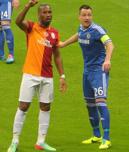 Centre-back John Terry (right) closely marks centre-forward Didier Drogba.