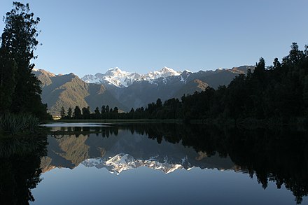 A picture postcard view of the Southern Alps from Lake Matheson