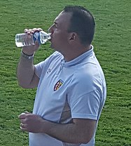 Vandeputte drinking water while coaching Lens U19 in 2016 Lens U19 - Tours U19 (03-04-2016) 31 (cropped).jpg