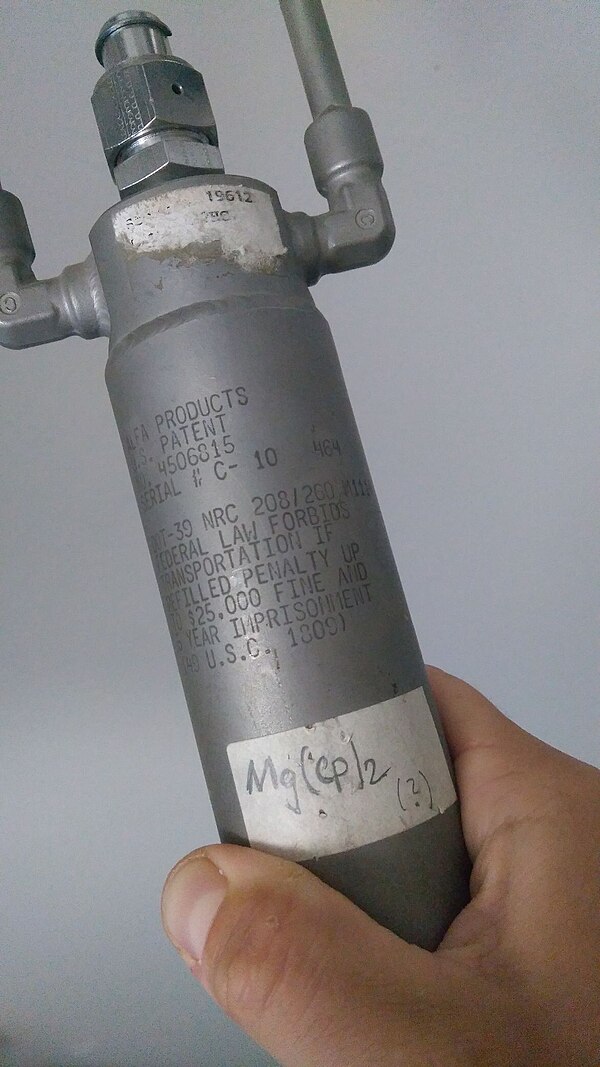 A steel bottle containing MgCp2 (magnesium bis-cyclopentadienyl), which, like several other organometallic compounds, is pyrophoric in air.