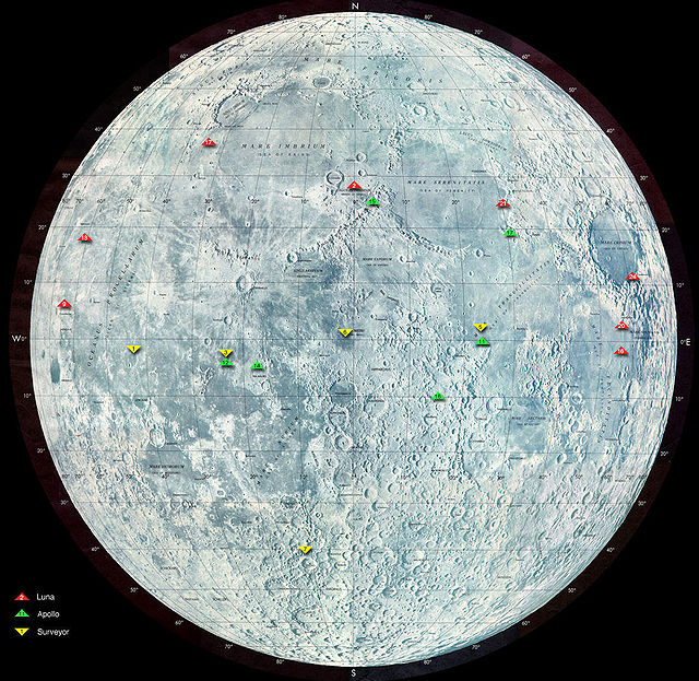 A representation of the Moon, with a cluster of green triangles indicating the Apollo landing sites