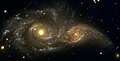 11 - NGC 2207 and IC 2163 collide