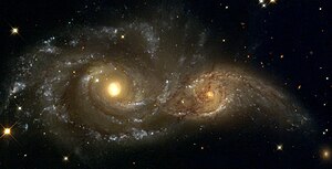 Galaxerna NGC 2207 och IC 2163.