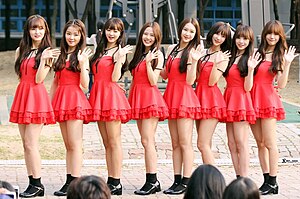 Oh My Girl in October 2015 (from left to right: Arin, Seunghee, Yooa, Hyojung, Jiho, Binnie, JinE, Mimi)