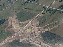 Construction in 2015 of the overpass and off-ramp at Harmony Road in Durham Region, the temporary terminus of the highway from June 20, 2016, until January 2, 2018. Ontario Highway 407 Construction at Harmony Road.JPG