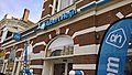 The opening of an Albert Heijn-branded supermarket, the logo is displayed several times in this image and the colour blue beautifully contrasts with the background.