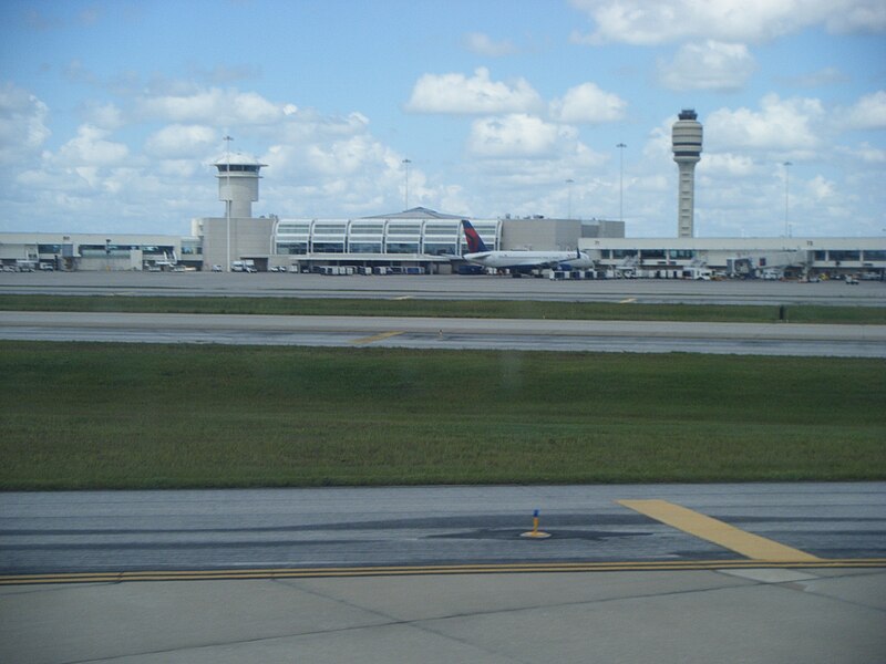 File:Orlando International Airport terminal from arriving airplane.jpg