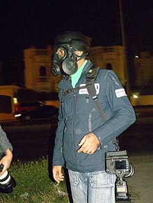 Reuters photographer Hamad I Mohamed wearing a gas mask while covering a protest Reuters photographer Hamad I Mohamed wearing a gas mask while covering a protest.JPG