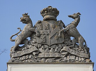 Heraldic achievement of Baron Rolle (died 1842) on top of main gates to Bicton House. RolleArmsOnBictonGates.JPG