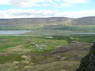 The mouth of the Eyjafjarðará, Pollurinn with the airport runway, middle distance, left center, Eyjafjörður with Hringvegur bridge on the far left