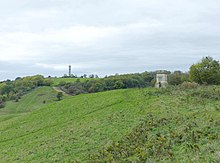 The grassy slopes of Purdown. This part is Stoke Park. The Purdown BT Tower and an obelisk base commemorating a death are visible. Slopes of Purdown, Bristol, England arp.jpg