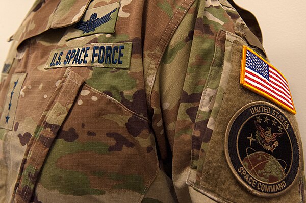 General John W. Raymond's Operational Camouflage Pattern U.S. Space Force uniform, displaying the Command Space Operations badge and United States Space Command patch.[1]