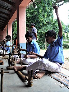 Spinning wheel represents Swadeshi and self suffficiency - Nai Talim-a basic education system A concept by Mahatma Gandhi implemented at Majhihira, Purulia- August 2011-P1480448-2.jpg