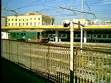 Catania Centrale station, seen in 2004 from the FS stop of the Catania Metro, which was discontinued in 2016. StazioneCT.jpg