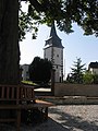 West tower with remains of the wall of the old Catholic Church