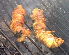 Stigghiola being cooked Stigghiola cooking.jpg