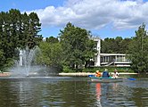 The Third Kamensky Pond. Pavilion No. 36 Produce Processing is seen behind trees. (2015).