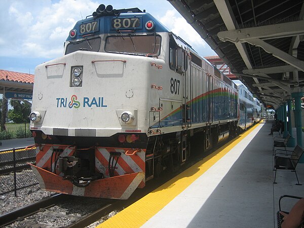 A northbound Tri-Rail train departing the station