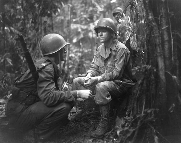 On the right, Major General J. L. Collins, commander of the 25th Division and, on the left, Major Charles W. Davis, commanding the 3rd Battalion, 27th