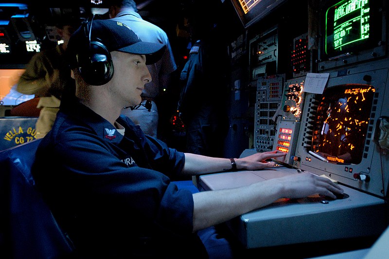 File:US Navy 031105-N-3725R-001 During the Battle Group Inport Exercise (BGIE) Operation Specialist 2nd Class Joseph Juracka checks for hostile and friendly contacts in a virtual combat environment.jpg