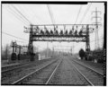 VIEW EAST TOWARD DARIEN ANCHOR BRIDGE -465 OF CIRCUIT BREAKER INSTALLATION ON CROSS BEAM OF BRIDGE. - New York, New Haven and Hartford Railroad, Bridge-Type Circuit Breakers, HAER CONN,1-COSCOB,2C-2.tif