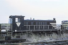 The former W&OD 55, a Whitcomb 75-ton diesel-electric switcher locomotive built in 1950, at the Baltimore and Ohio Railroad's Riverside Yard in Baltimore in January 1969. Washington & Old Dominion RR Whitcomb 75 Tonner 55 at B&O Riverside Yard, January 19, 1969.jpg