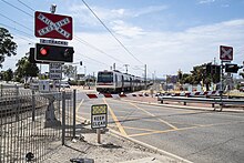 Level crossing with a train crossing through