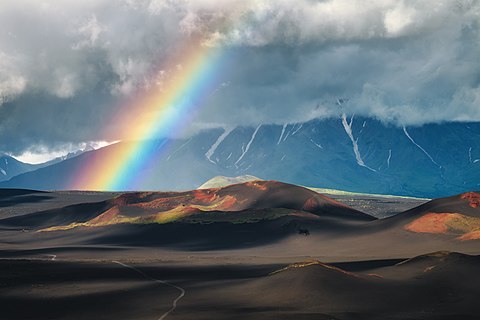 Rainbow over volcanic cones