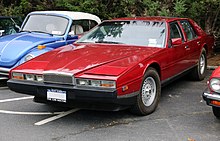 The Series 2 model has pop-up headlights and a design in-line with folded paper wedged shaped trend of the 1970s 1984 Aston Martin Lagonda (11720661564).jpg