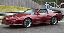 1987 Pontiac Trans Am 1987 Pontiac Firebird Trans Am in Flame Red Met., front left side (Lime Rock).jpg