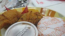 Two pieces of Chicken Joy from Jollibee, the chain's core product, along with a serving of rice 2pcs Chicken Joy Bohol.jpg