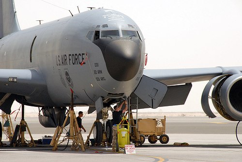 A mechanic of the 380th Expeditionary Aircraft Maintenance Squadron working on one of the wing's KC-135 Stratotankers