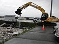 390 Excavator removes debris (15122147242).jpg