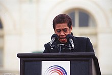 Norton speaking at a 1998 rally against the impeachment of Bill Clinton 46.AntiImpeachRally.WDC.17December1998 (22698038506).jpg