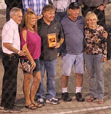 Watson (center) being inducted in the Madison International Speedway Hall of Fame, 2015. He is standing beside his daughter (2nd from left) and Watson's wife is standing on the right 7.8.16 Madison International Speedway - Fr. Grubba Dave Watson Johnny Ziegler.jpg