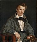 Den daværenede 20-årige bergenskunstneren Joachim Frich med knyttet kravatt og arbeidskittel malt av Adolph Tidemand 1830. Foto: Digitalt Museum