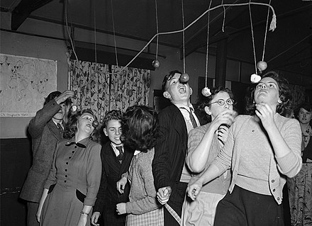 Apple-bobbing at Ditherington Hallowe'en party (1950)