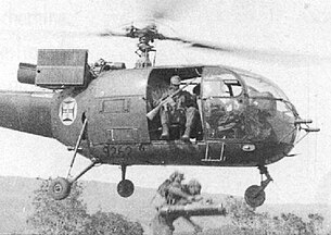 Portuguese paraquedistas armed with AR-10 rifles disembark from an Alouette III helicopter during the Angolan War of 1961-1974. AssaltonaMatadaSanga.jpg