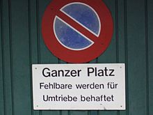 An example of Swiss Standard German used for a "no parking" sign. Fehlbare werden fur Umtriebe behaftet would rather be expressed as Zuwiderhandelnde haften fur die Kosten des entstehenden Aufwands in German Standard German. "Fehlbare" (as used in this context), "Umtriebe", and "behaftet" are Helvetisms. Basel-Parkverbot.JPG