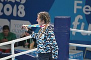 Deutsch: Boxen bei den Olympischen Jugendspielen 2018 Tag 12, 18. Oktober 2018 - Medaillenzeremonie im Leichtgewicht der Mädchen - Gold: Caroline Sara DuBois (Großbritannien), Silber: Porntip Buapa (Thailand), Bronze: Oriana Saputo (Argentinien); Medaillenübergabe durch Habu Gumel (IOC, Nigeria), Geschenkübergabe durch Raymond Silvas (USA, AIBA). English: Boxing at the 2018 Summer Youth Olympics on 18 October 2018 – Girl's Lightweight Medal Ceremony - Gold: Caroline Sara DuBois (Great Britain), Silver: Porntip Buapa (Thailand), Bronze: Oriana Saputo (Argentina); Medal handover by Habu Gumel (IOC, Nigeria), Gift presented by Raymond Silvas (USA, AIBA). Español: Boxeo en los Juegos Olímpicos Juveniles de Verano de 2018 en 18 de octubre de 2018 - Ceremonia de la Medalla de peso ligero para niñas - Oro: Caroline Sara DuBois (Gran Bretaña), Plata: Porntip Buapa (Thailand), Bronce: Oriana Saputo (Argentina); Entrega de medallas por Habu Gumel (COI, Nigeria), Regalo presentado por Raymond Silvas (EE. UU., AIBA).