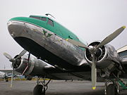 Nose of a Buffalo Airways DC3 at Yellowknife. This is the first aircraft purchased by "Buffalo" Joe McBryan as indicated by the "Summer Wages" sign.