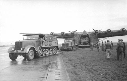 German reinforcements; a Sd.Kfz. 8 half-track and a Praga T-6 artillery tractor pull cargo from a Messerschmitt Me 323 Gigant transport