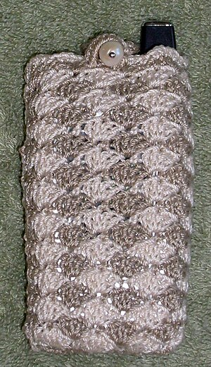 A cell phone cover made from shell stitch crochet in two colors. Cell phone cover.jpg