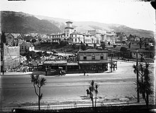 Thorndon, the centre of government in Wellington, c. 1929. The original Government House (now the site of the Beehive), Parliament Buildings and Turnbull House are in the background. Corner of Bowen Street and Lambton Quay, circa 1929.jpg