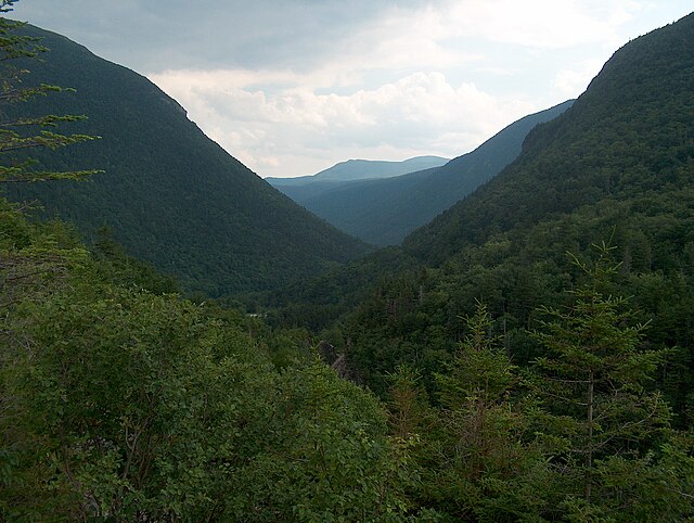 Present-day Crawford Notch, looking south from Elephant Head rock (visible to left of notch in Thomas Cole painting)
