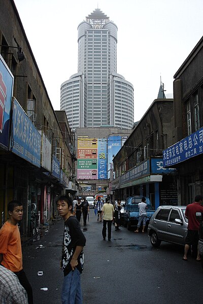 File:Dalian Bank Tower and older shops 2005.jpg