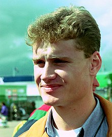 Coulthard in the paddock at the 1993 British Grand Prix as Williams test driver David Coulthard in the paddock for the 1993 British Grand Prix (33645946546) cropped.jpg